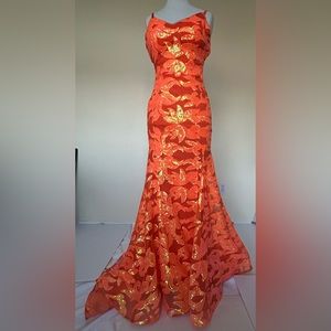 Preowned Berlinnova sequined gown size 2
Orange in color